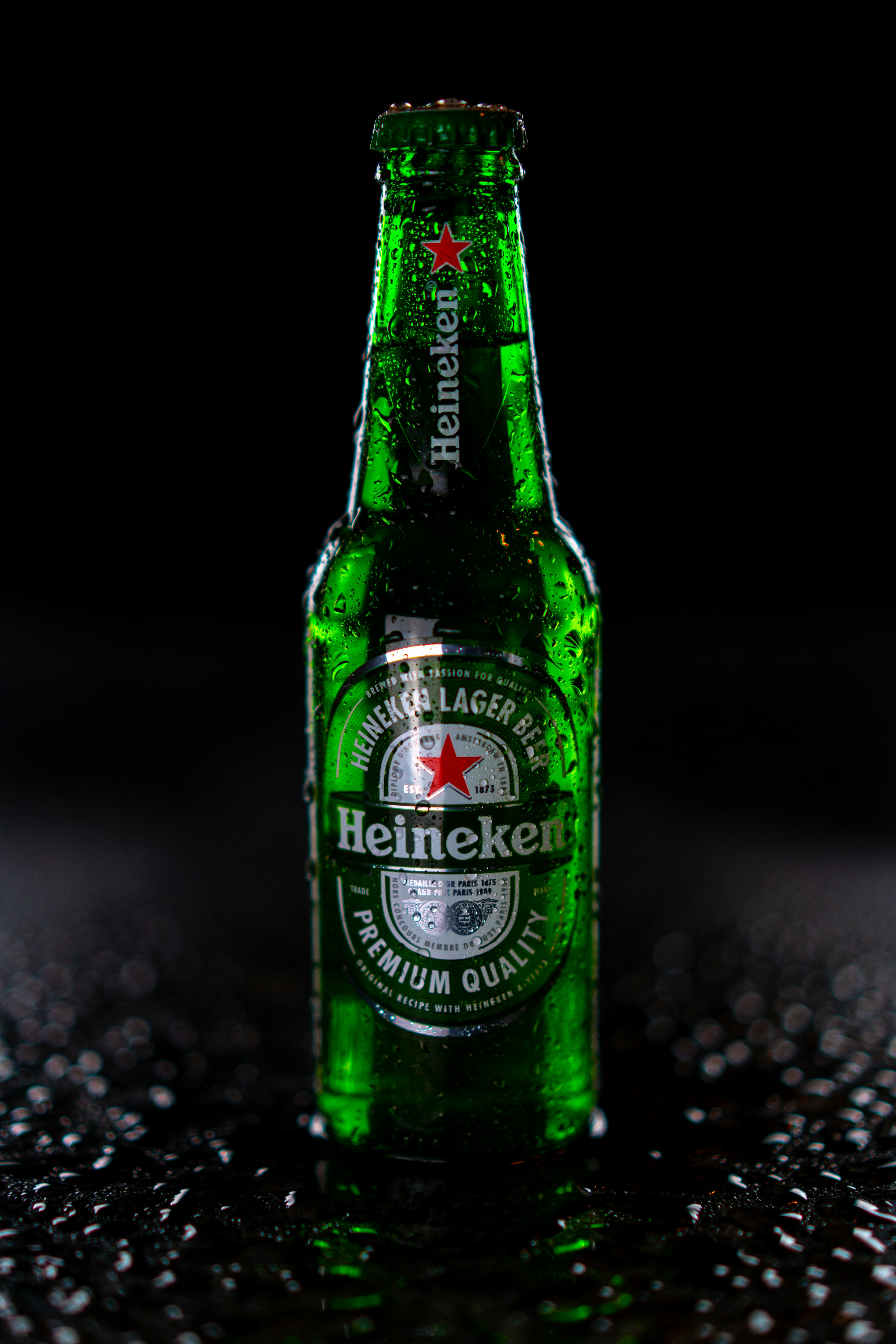 heineken bottle on black and white marble table